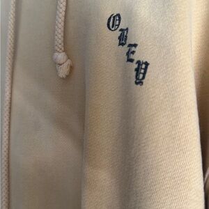Obey Cream Hoodie with Black Lettering